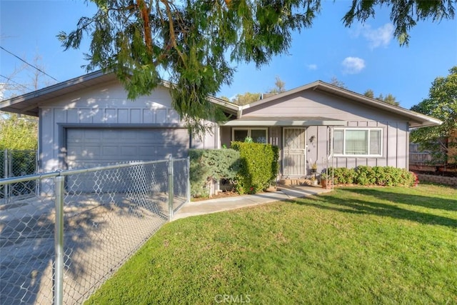 single story home featuring a garage and a front yard