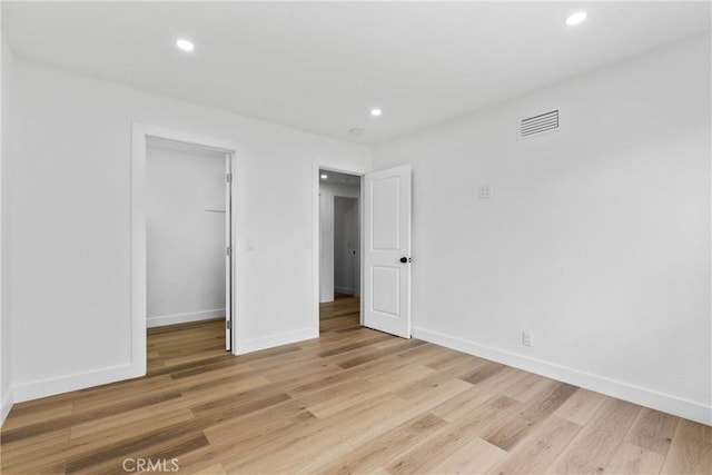 5594 Denver St, Montclair, CA 91763 - unfurnished bedroom with light wood finished floors, visible vents, and recessed lighting