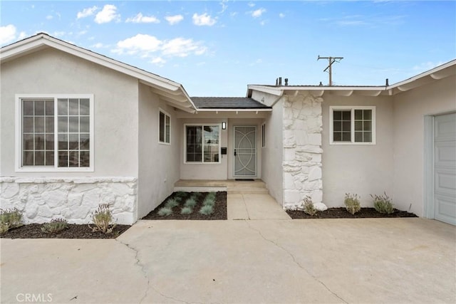 5594 Denver St, Montclair, CA 91763 - entrance to property featuring stucco siding and stone siding