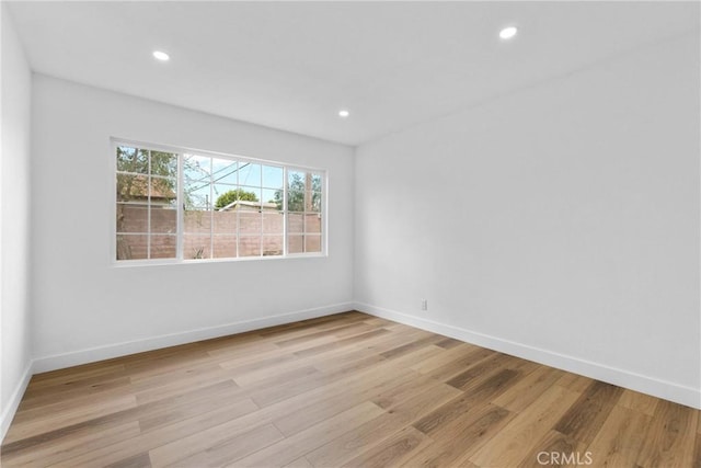 5594 Denver St, Montclair, CA 91763 - spare room with baseboards, light wood-style floors, and recessed lighting
