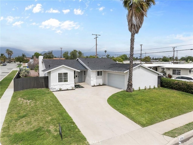5594 Denver St, Montclair, CA 91763 - ranch-style home with driveway, an attached garage, fence, a front yard, and stucco siding