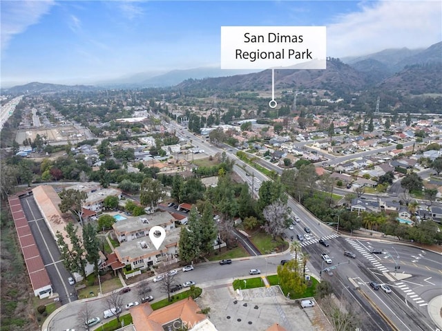 birds eye view of property featuring a mountain view