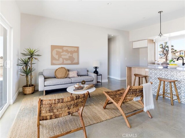 living room featuring concrete floors