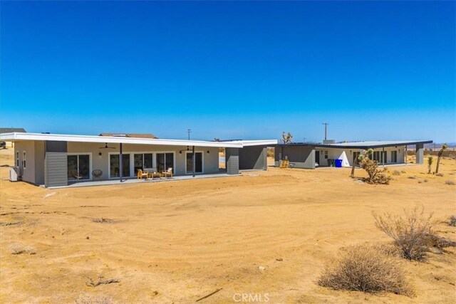 rear view of house featuring a patio