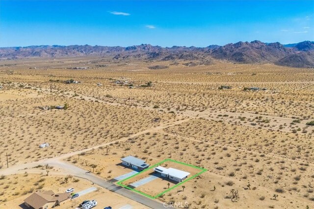 drone / aerial view featuring a mountain view