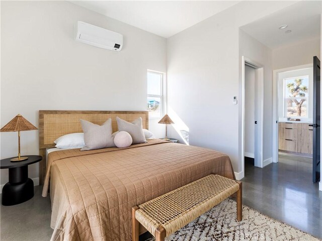 bedroom featuring multiple windows and a wall mounted air conditioner