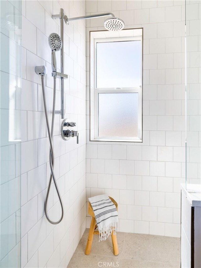 bathroom with tiled shower