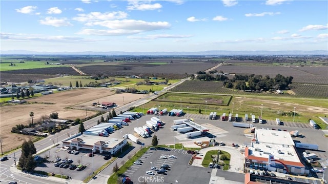 birds eye view of property with a rural view