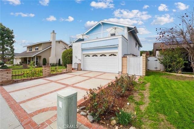 traditional-style home with concrete driveway, a gate, fence, a garage, and a front lawn