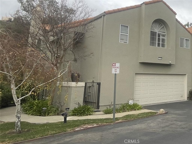 view of property exterior with a garage