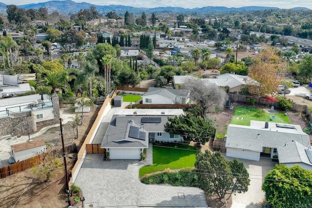 birds eye view of property with a mountain view