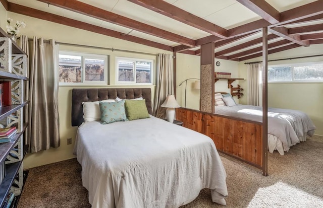 bedroom featuring carpet floors, multiple windows, and vaulted ceiling with beams