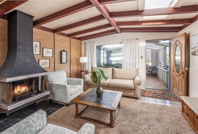 tiled living room with lofted ceiling with beams