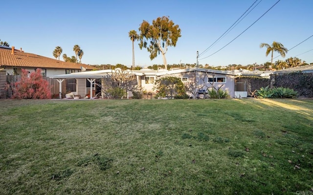 back of house with a yard