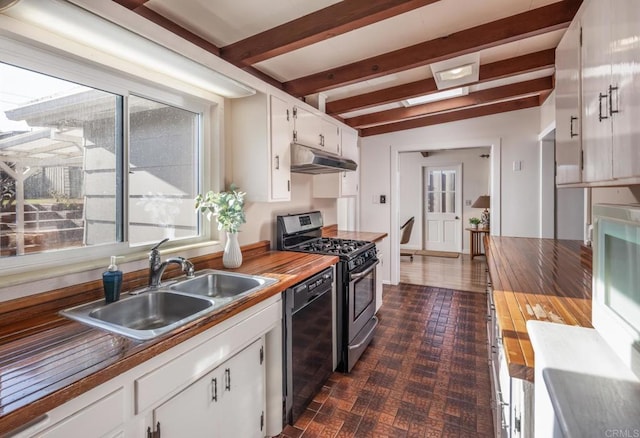 kitchen with white cabinetry, wooden counters, and stainless steel gas range