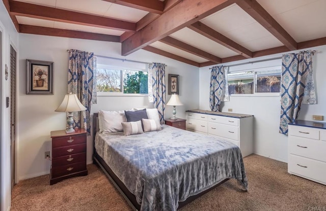 carpeted bedroom with lofted ceiling with beams