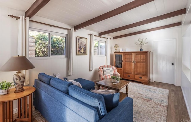 living room featuring beamed ceiling, wood ceiling, and dark hardwood / wood-style flooring