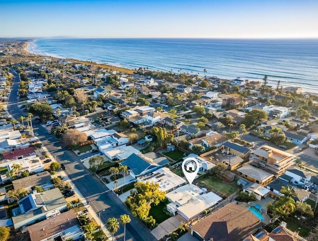 birds eye view of property with a water view and a residential view