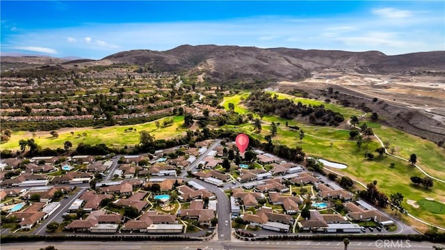 birds eye view of property featuring a mountain view