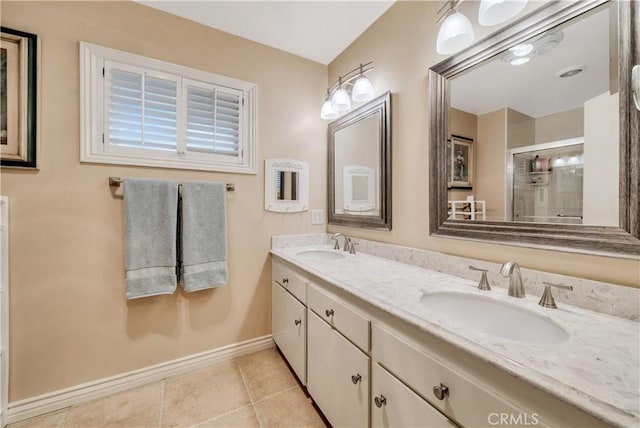 bathroom with tile patterned flooring, vanity, and an enclosed shower