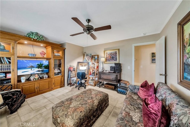 living room featuring crown molding and ceiling fan