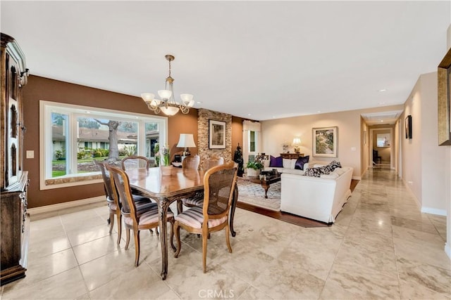 dining area featuring an inviting chandelier