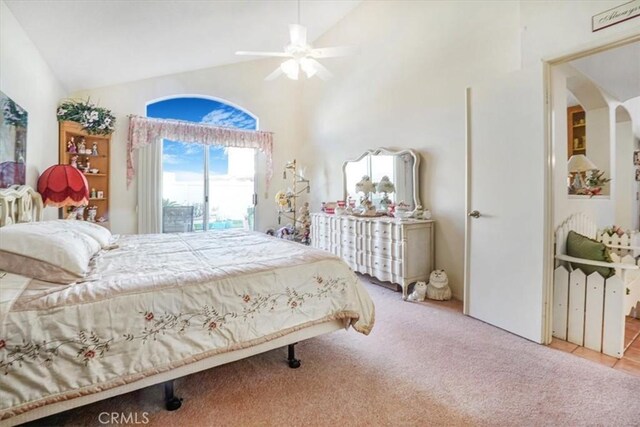 1308 Pleasant Valley Ave, Banning, CA 92220 - bedroom with ceiling fan, high vaulted ceiling, light tile patterned floors, arched walkways, and light carpet
