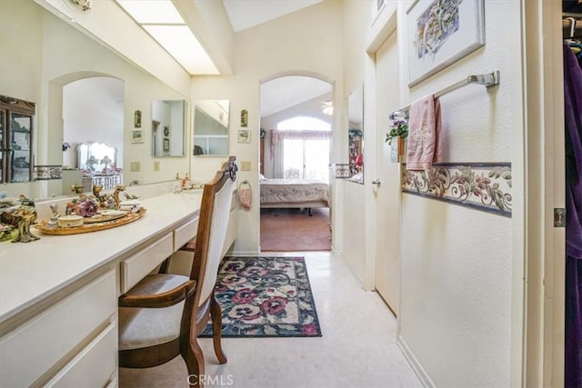 1308 Pleasant Valley Ave, Banning, CA 92220 - ensuite bathroom with lofted ceiling, connected bathroom, vanity, and tile patterned floors