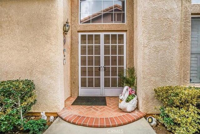 1308 Pleasant Valley Ave, Banning, CA 92220 - property entrance with french doors and stucco siding