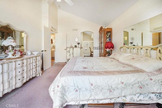 1308 Pleasant Valley Ave, Banning, CA 92220 - carpeted bedroom featuring visible vents, arched walkways, ceiling fan, ensuite bathroom, and high vaulted ceiling