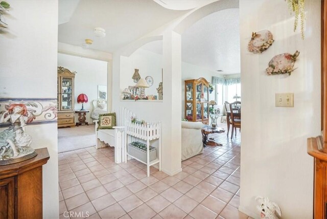 1308 Pleasant Valley Ave, Banning, CA 92220 - hallway with light tile patterned floors and arched walkways