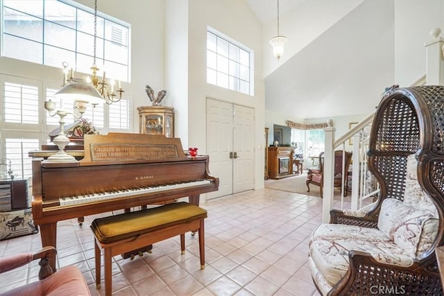 1308 Pleasant Valley Ave, Banning, CA 92220 - entrance foyer with a chandelier, stairs, and a wealth of natural light