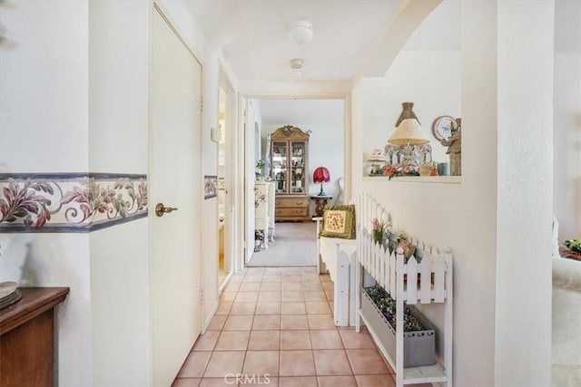 1308 Pleasant Valley Ave, Banning, CA 92220 - hallway featuring arched walkways and light tile patterned flooring