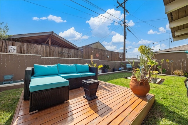 wooden terrace featuring an outdoor hangout area and a lawn