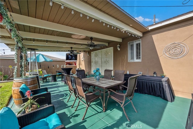 view of patio / terrace featuring ceiling fan