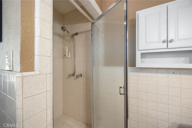 bathroom with a shower with shower door