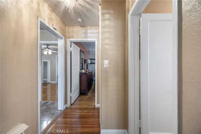 hall featuring dark wood-type flooring