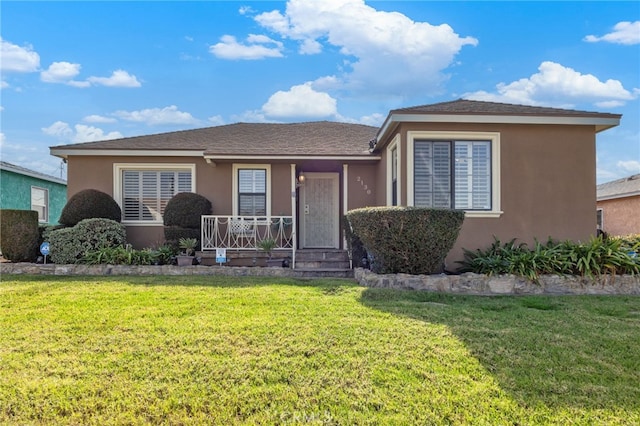 view of front of property with a porch and a front yard