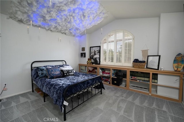 bedroom featuring vaulted ceiling and carpet