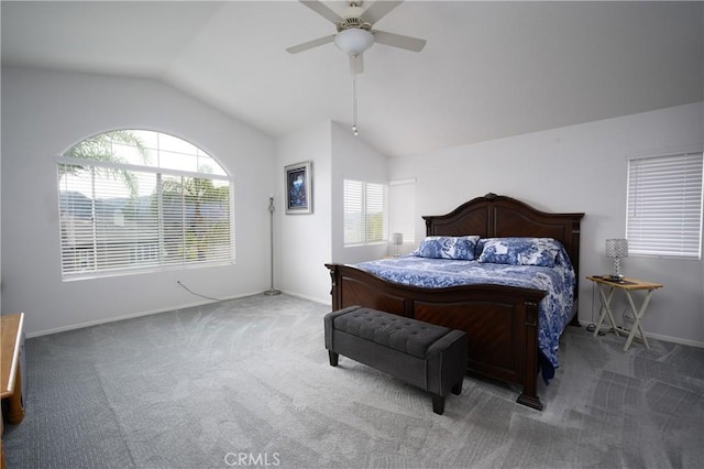 carpeted bedroom featuring multiple windows, vaulted ceiling, and ceiling fan