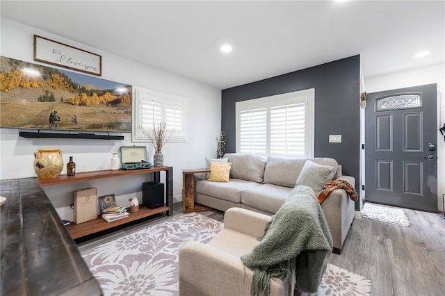 living room featuring recessed lighting and wood finished floors