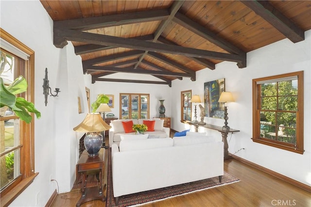 living room featuring vaulted ceiling with beams, hardwood / wood-style floors, and wooden ceiling