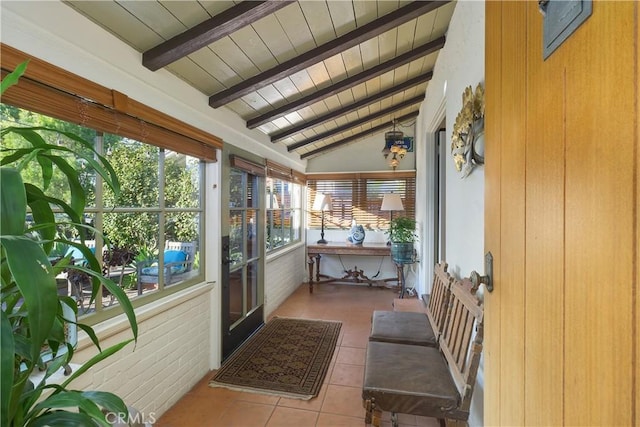 sunroom with vaulted ceiling with beams and wood ceiling