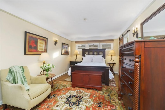 bedroom featuring multiple windows and wood-type flooring