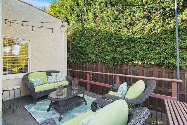 wooden terrace featuring outdoor lounge area