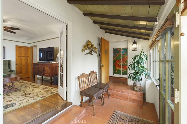 interior space with lofted ceiling with beams, light tile patterned floors, and wood ceiling