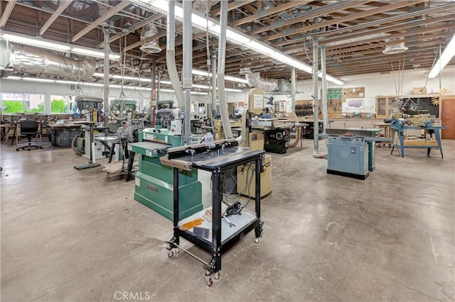 interior space with concrete flooring and a workshop area