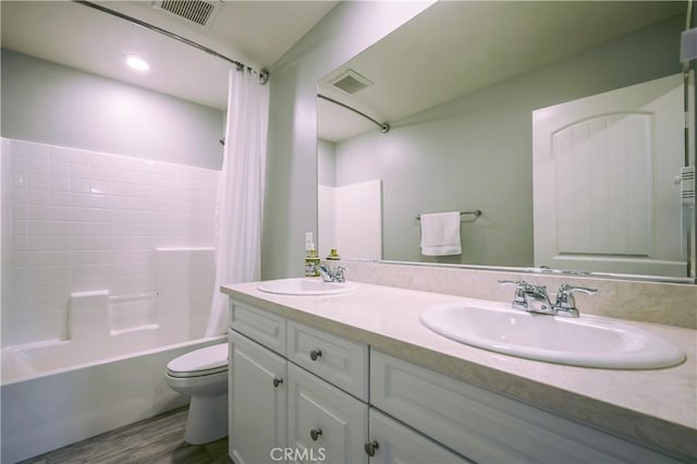 bathroom featuring visible vents, a sink, and toilet