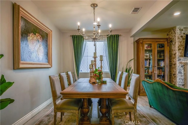 3554 Twinberry Ln, San Bernardino, CA 92407 - dining area featuring a chandelier and wood finished floors