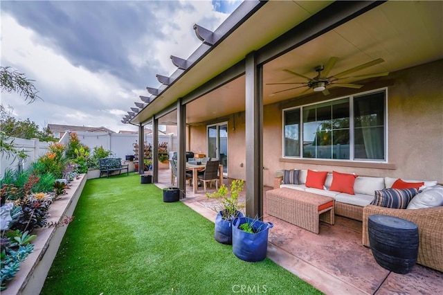 3554 Twinberry Ln, San Bernardino, CA 92407 - fenced backyard with outdoor lounge area, a patio, and a ceiling fan